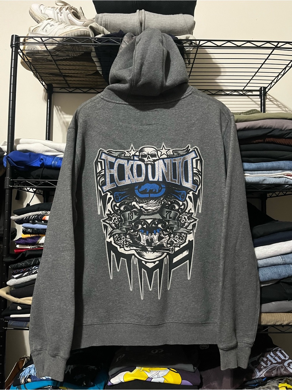 Ecko Unlimited Gray Hoodie with Blue & White Skull Crest Graphic